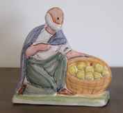 Shepherd with a basket of oranges